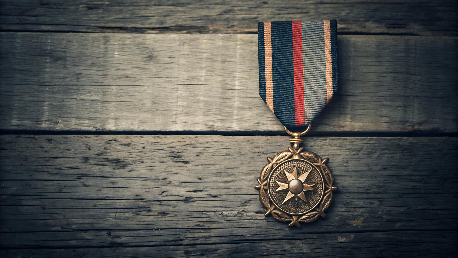 Vintage Gold Medal with Ribbon on Rustic Weathered Wooden Surface Symbolizing Achievement