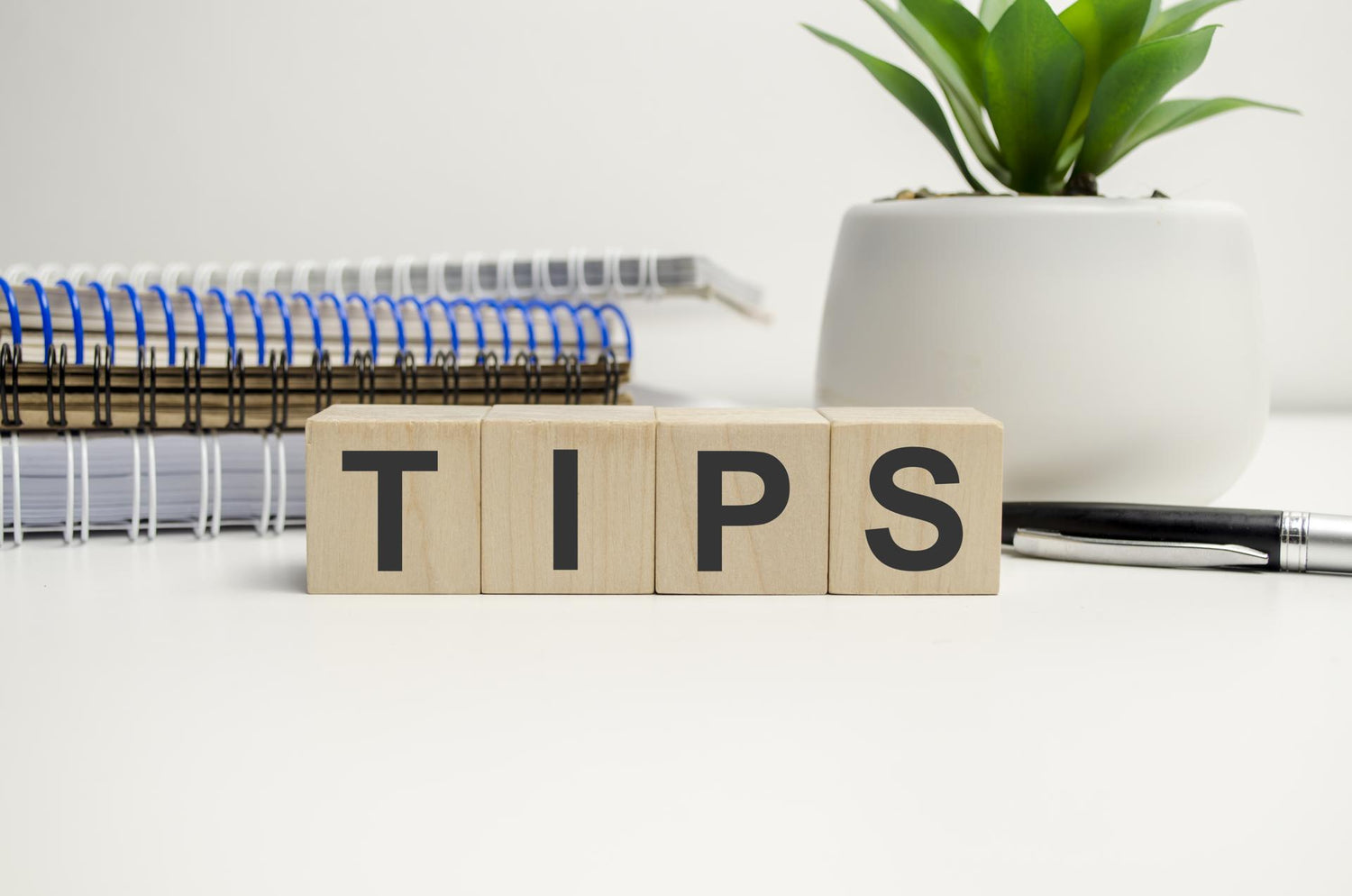 Tips word on wooden cubes and notepads